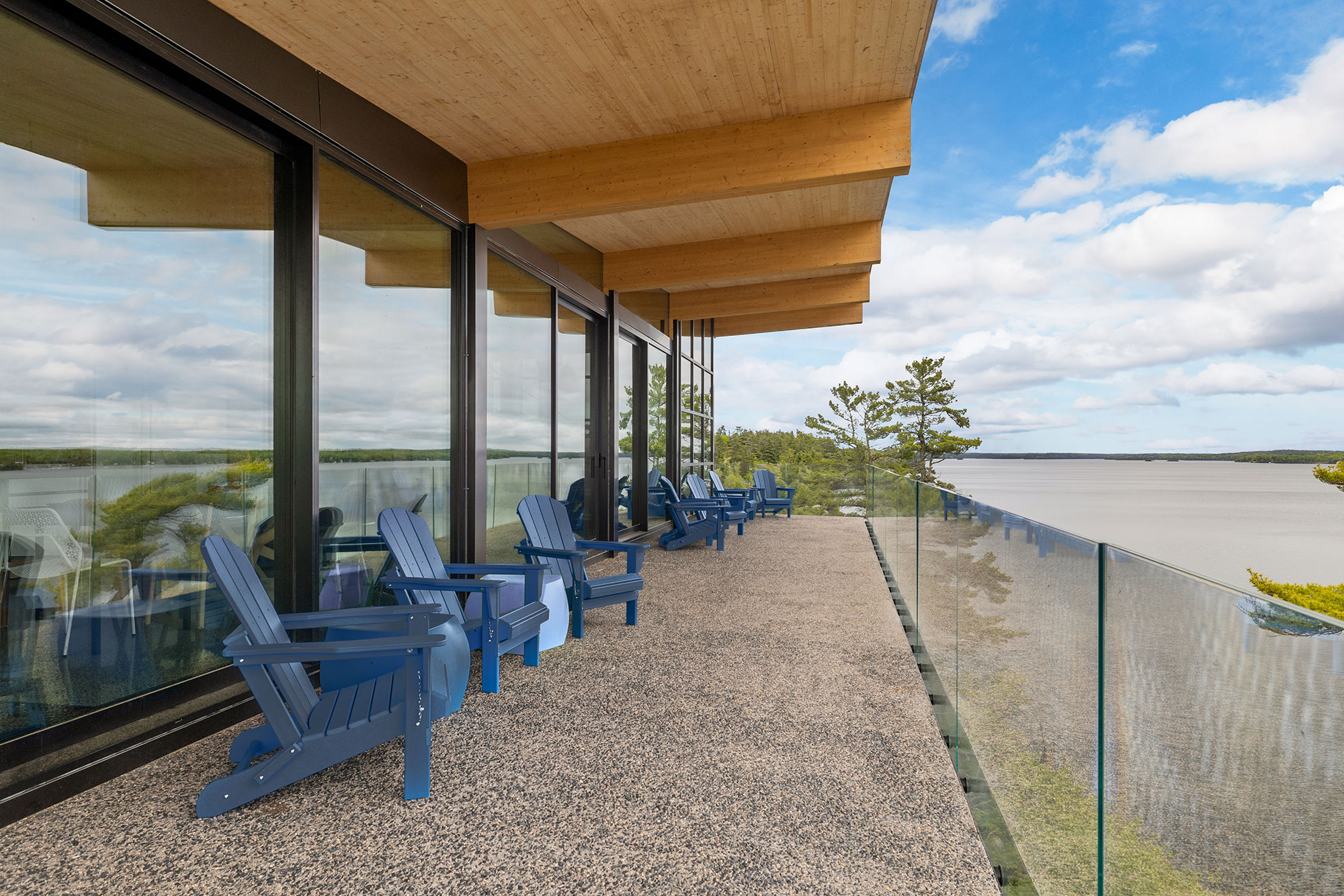 Lake house exterior with large balcony